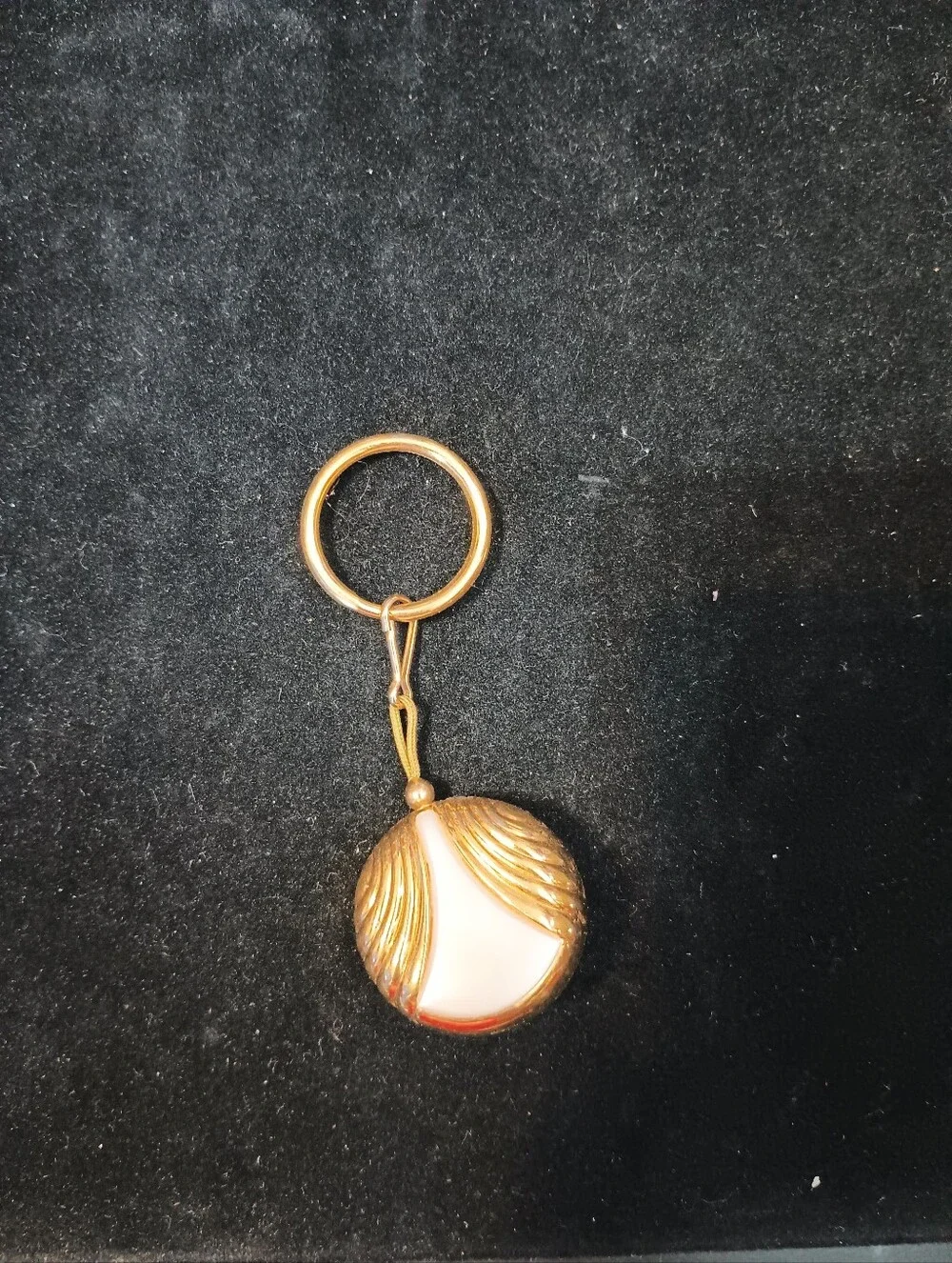 Vintage Avon Badge Reel. Gold Tone With Pearlesque Center